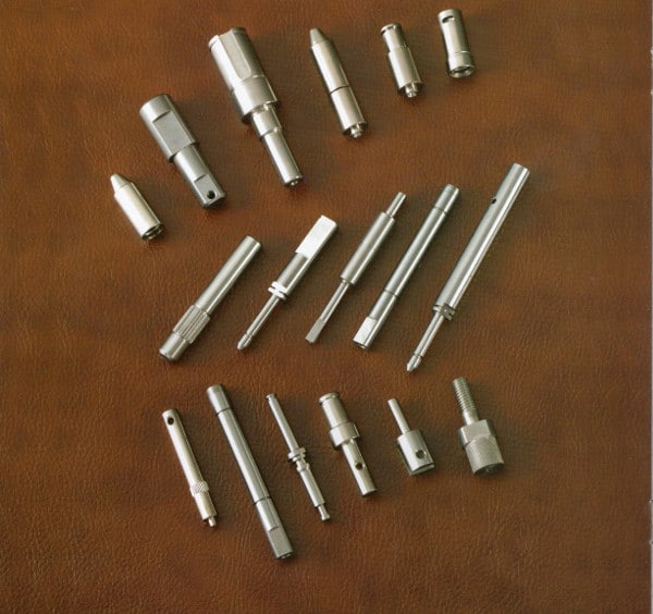 Stepped shafts are shown combined with splining, D-shaped ends and holes drilled into them.